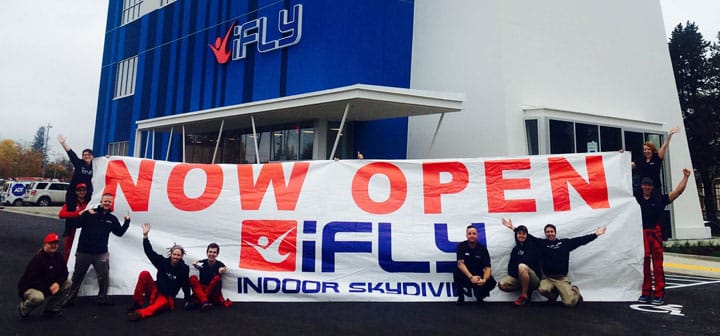 iFLY Portland Staff with Banner in Front of the Tunnel